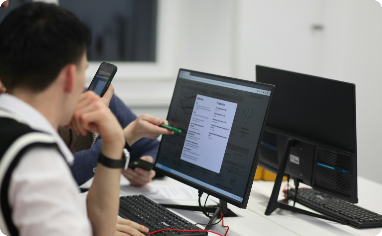 image of working people in front of monitor